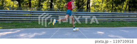 side view male athlete running marathon race on asphalt road side view male athlete running marathon race on asphalt road 119710918