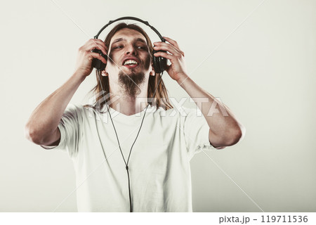 Happy man with headphones Happy man with headphones 119711536