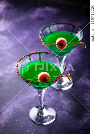 Spooky green eyeball martinis for halloween 119712226
