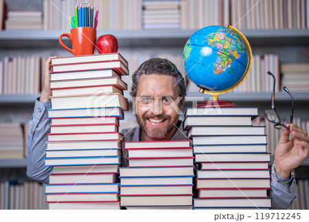 teachers and knowledge day. clever school teacher. bookworm man in classroom. school teacher with book literature. education in school library. man bookworm getting knowledge. Reading habits teachers and knowledge day. clever school teacher. bookworm man in classroom. school teacher with book literature. education in school library. man bookworm getting knowledge. Reading habits 119712245