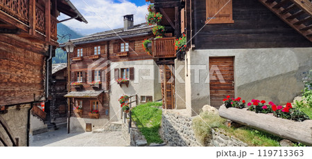 Most beautiful Swiss villages - pretty Griementz with traditional wooden houses and floral streets. popular tourist attraction in Valais Canton of Switzerland Most beautiful Swiss villages - pretty Griementz with traditional wooden houses and floral streets. popular tourist attraction in Valais Canton of Switzerland 119713363