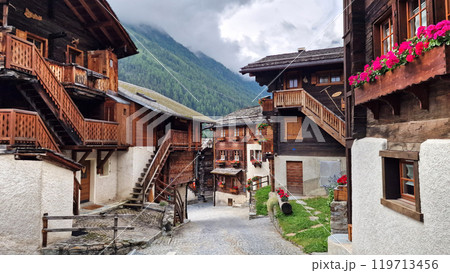 Most beautiful Swiss villages - pretty Griementz with traditional wooden houses and floral streets. popular tourist attraction in Valais Canton of Switzerland Most beautiful Swiss villages - pretty Griementz with traditional wooden houses and floral streets. popular tourist attraction in Valais Canton of Switzerland 119713456