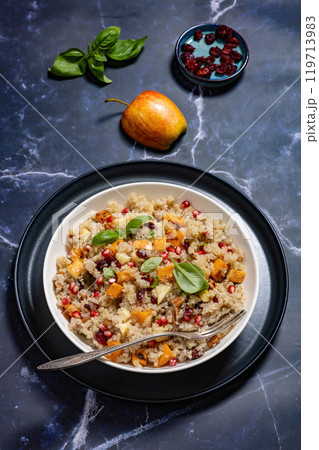 winter quinoa salad with roasted squash in a bowl 119713983