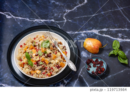 winter quinoa salad with roasted squash in a bowl 119713984