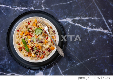 winter quinoa salad with roasted squash in a bowl 119713985