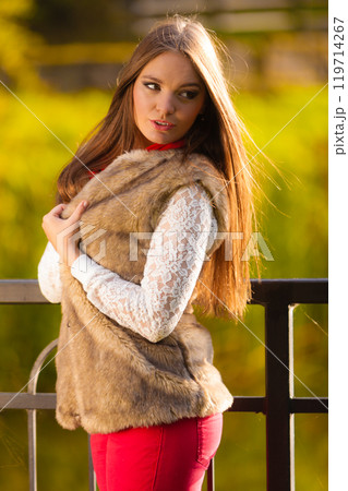 Portrait girl relaxing walking in autumnal park. Portrait girl relaxing walking in autumnal park. 119714267