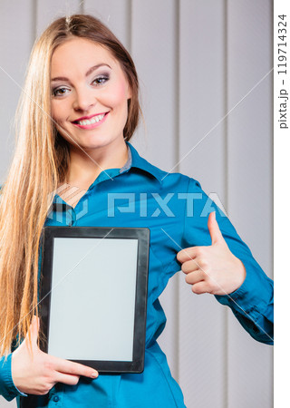 Young office worker hold tablet with thumb up. Young office worker hold tablet with thumb up. 119714324