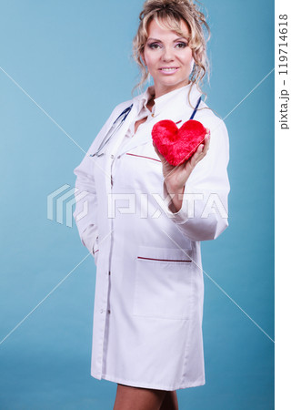 Middle aged blonde doctor enjoy her work. 119714618