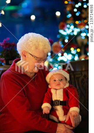Family with kids having Christmas dinner at tree Family with kids having Christmas dinner at tree 119714698