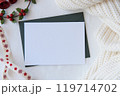 Christmas Card Mockup with Pine Branches and Holly, Cozy Holiday Scene 119714702