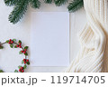 Blank Christmas Card Mockup with Holly and Cozy Decorations 119714705