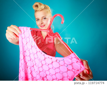 Pinup girl buying clothes pink dress. Sale retail. 119714774
