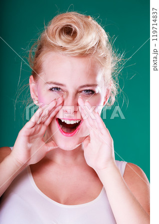 Lovely young girl screaming, hands close to mouth 119714837