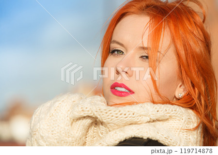 Beauty face red hair woman in warm clothing outdoor Beauty face red hair woman in warm clothing outdoor 119714878