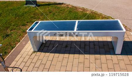 Bench with solar panels at the bike stand. Alternative energy source. Energy crisis. 119715028