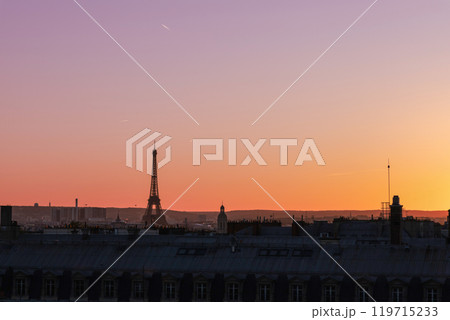 View of Paris and Eiffel Tower and rooftops from above. Beautiful sunset over Paris, France View of Paris and Eiffel Tower and rooftops from above. Beautiful sunset over Paris, France 119715233