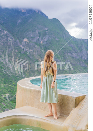 Female tourist at the hot springs of Grutas Tolantongo, Mexico. Adventure, relaxation, and natural wellness concept 119716004