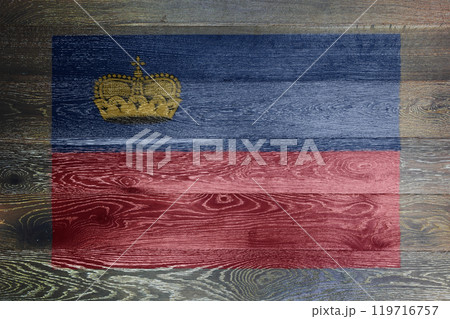 Liechtenstein flag on rustic old wood 119716757