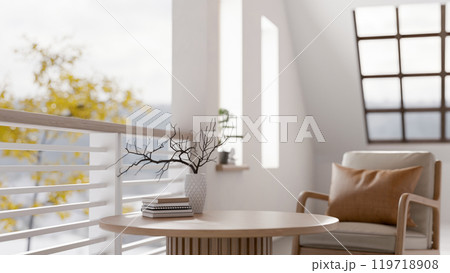 A comfortable contemporary relaxation area featuring a round wooden coffee table and an armchair. A comfortable contemporary relaxation area featuring a round wooden coffee table and an armchair. 119718908