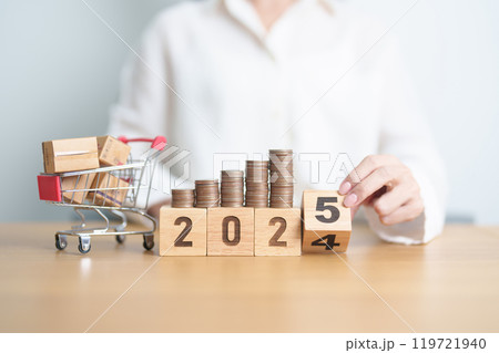 2024 end year to Happy New Year 2025 with shopping cart and money coins stack. online shopping, Marketplace platform website, technology, ecommerce, shipping delivery, logistics and online payment 119721940