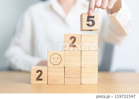 Happy New Year 2025 with Sad face block. Satisfaction, feedback, Review, mental health, eco sustainable and bad year concept Happy New Year 2025 with Sad face block. Satisfaction, feedback, Review, mental health, eco sustainable and bad year concept 119722347