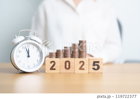Happy New Year 2025 with clock and coins stack arrangement. Money Saving for Future Plan, Retirement fund, Pension, Investment, Wealth Business, Financial and countdown concepts 119722377