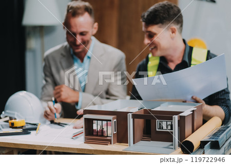 Team Engineers with draft plan of building on constructing site. Engineer work on site. engineer visit and inspection site engineer. Inspector engineer check and working on site. 119722946