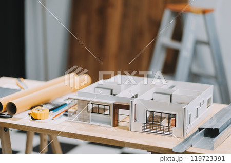 Team Engineers with draft plan of building on constructing site. Engineer work on site. engineer visit and inspection site engineer. Inspector engineer check and working on site. Team Engineers with draft plan of building on constructing site. Engineer work on site. engineer visit and inspection site engineer. Inspector engineer check and working on site. 119723391