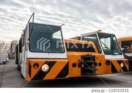 Tow truck in the parking airport machinery Tow truck in the parking airport machinery 119723535