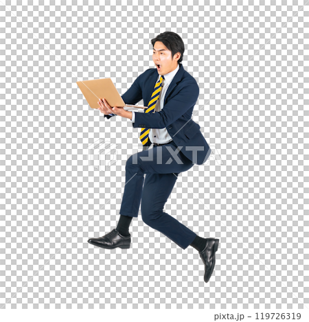 A young male business person jumping while using a laptop computer. Full body with transparent background precisely cut out by hand. A young male business person jumping while using a laptop computer. Full body with transparent background precisely cut out by hand. 119726319
