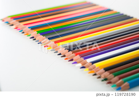 Colored pencils lying in row Colored pencils lying in row 119728190