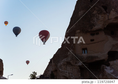 Colorful hot air balloons fly gracefully over a vibrant skyline in valley Cappadocia Turkey 119728847