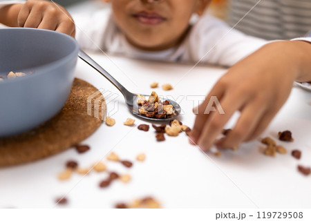 Close up picture of a table with a spilled cereals Close up picture of a table with a spilled cereals 119729508