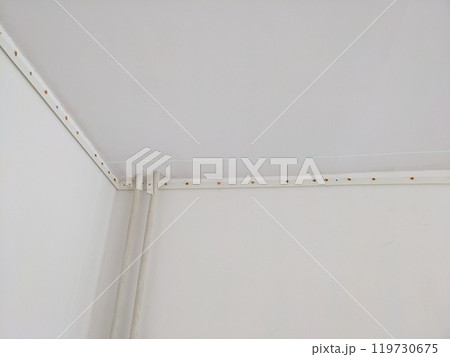 Stretch a white ceiling install in a room Stretch a white ceiling install in a room 119730675
