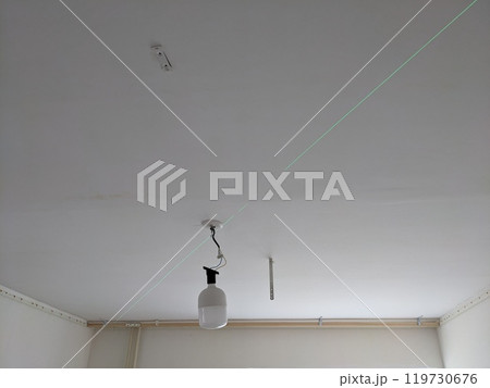 The process of installing a stretch ceiling on a laser level. 119730676
