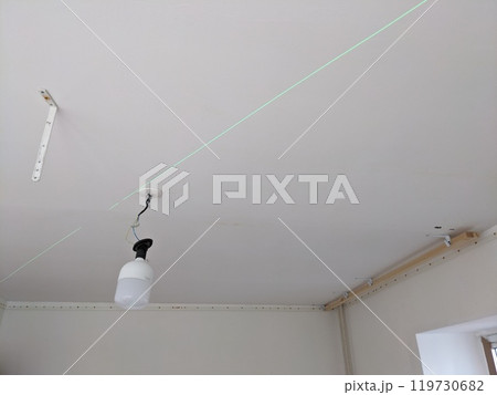 marking on the ceiling. Installation of a stretch ceiling marking on the ceiling. Installation of a stretch ceiling 119730682