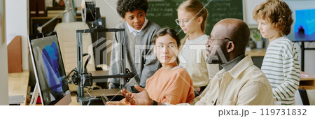 Teacher and students participating in engaging classroom discussion focusing on technology and innovation Teacher and students participating in engaging classroom discussion focusing on technology and innovation 119731832