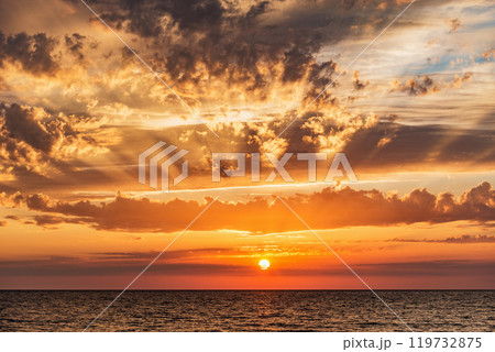 Amazing sunset sky above the sea surface. 119732875