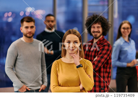 Portrait of successful creative business team looking at camera and smiling. Diverse business people standing together at startup. Selective focus  119735409