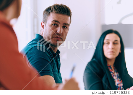 Diverse Business Team Discussing Projects in a Modern Glass Office. Diverse Business Team Discussing Projects in a Modern Glass Office. 119736328