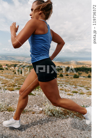 Empowered Runner Embracing Nature's Beauty on a Serene Morning Trail. Empowered Runner Embracing Nature's Beauty on a Serene Morning Trail. 119736372