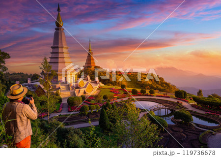 Photographer taking photos at Doi Inthanon national park in winter in sunset of Thailand. Pagoda on Inthanon national park at Chiang mai, Thailand. 119736678