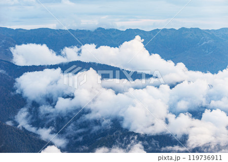 Clouds above the mountains at sunset. Clouds above the mountains at sunset. 119736911