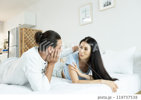 happy man woman couple romantic lying together lover on bed. 119737538