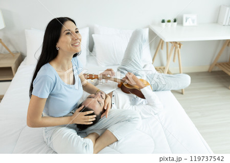 happy man woman couple romantic lying together lover on bed. happy man woman couple romantic lying together lover on bed. 119737542