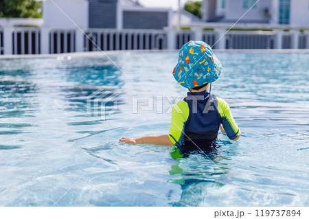 Happy vacation kid boy have fun enjoy at swimming pool. Happy vacation kid boy have fun enjoy at swimming pool. 119737894
