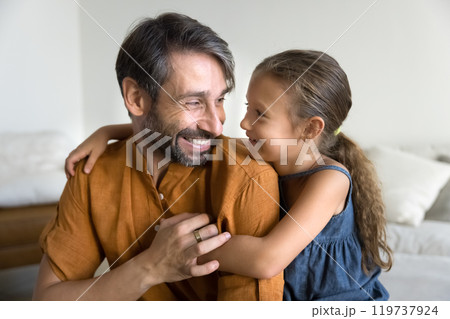 Cheerful daddy and playful happy daughter kid hugging and laughing 119737924