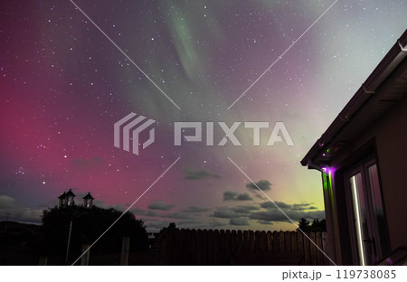 The Aurora Borealis, the northern lights, showing up above bungalow in County Donegal, Ireland 119738085