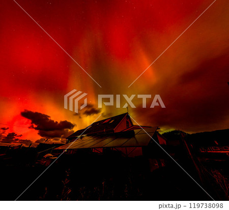 The Aurora Borealis, the northern lights, showing up above bungalow in County Donegal, Ireland 119738098