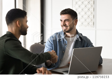 Positive young Arabic business partners starting collaboration 119738153